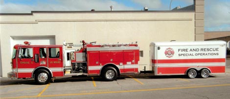 Fire truck with a trailer attached that has Fire and Rescue Special Operations on the side